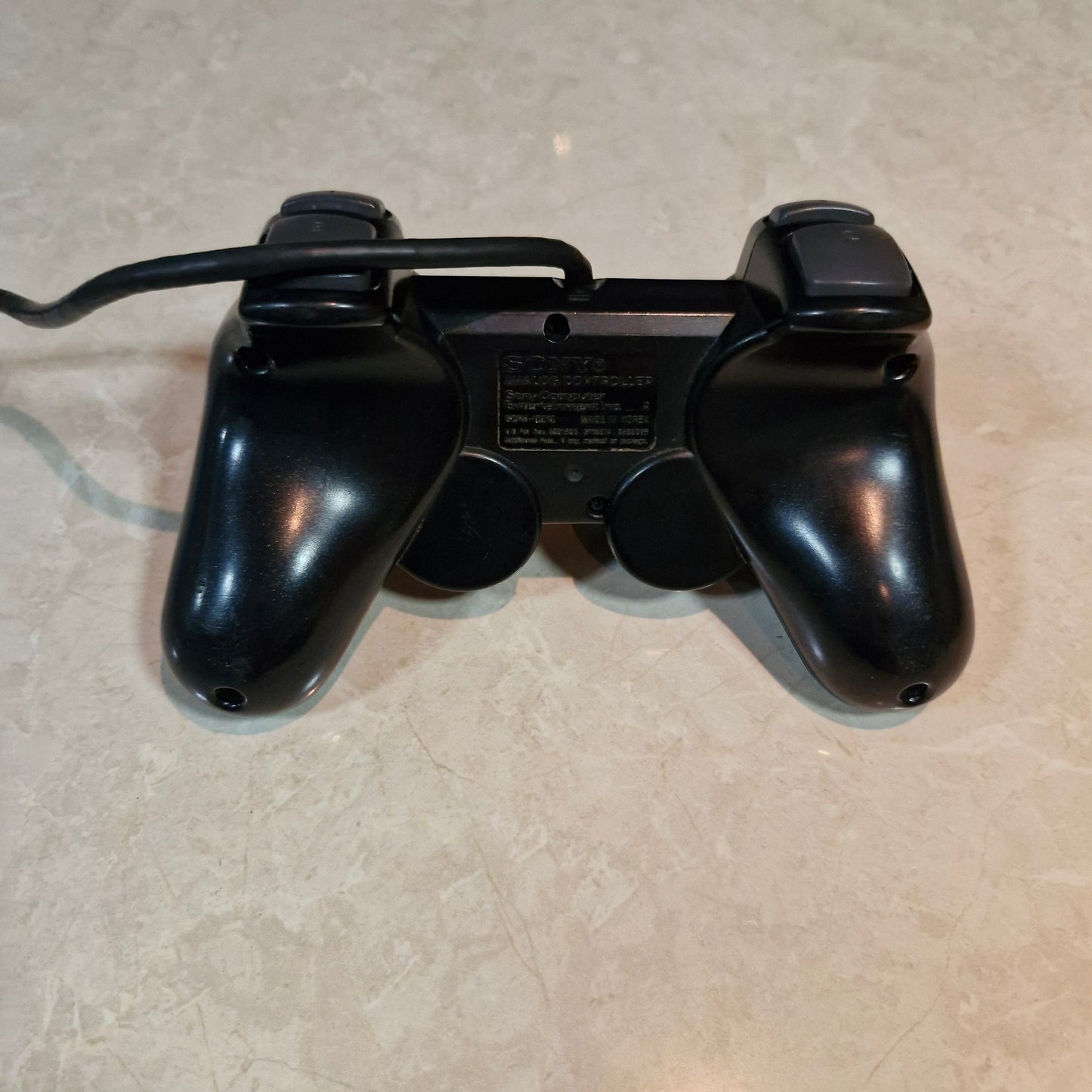 Sony PlayStation DualShock Wired Controller – Black (PS1/PS2 Compatible, Original)